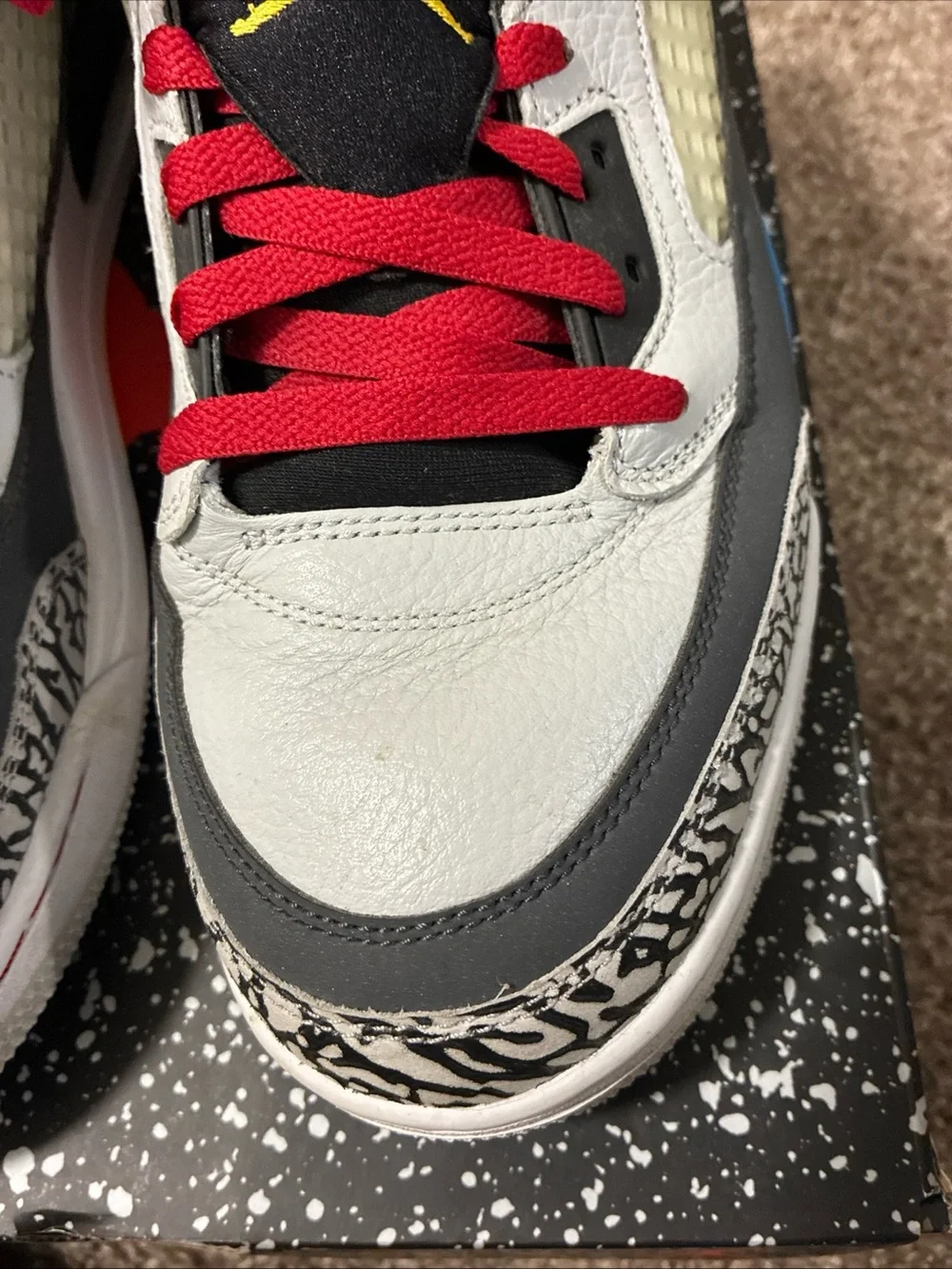 Jordan Men's White Athletic Shoes with Black, Red & Blue Accents